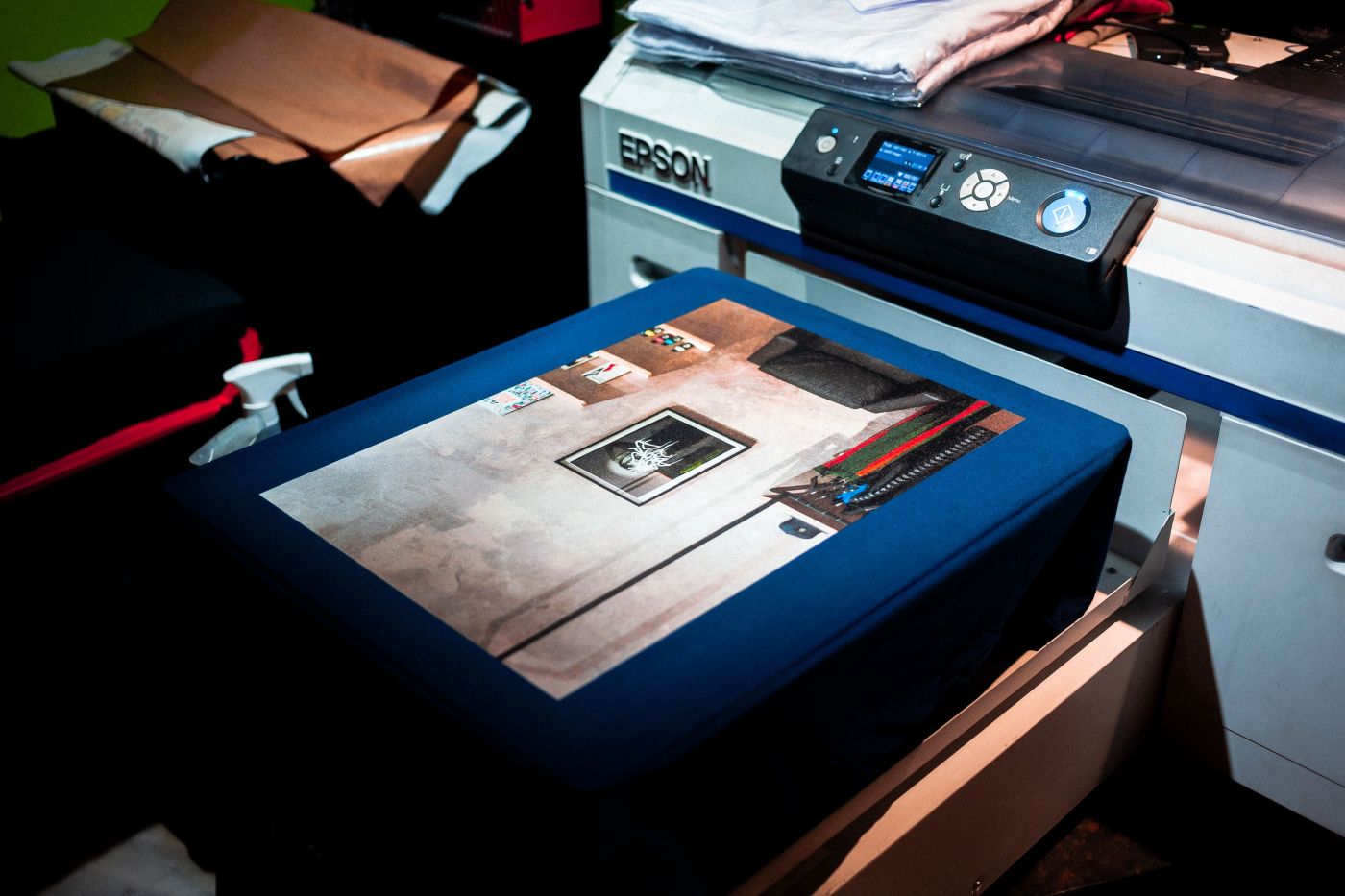 Large-format printer producing a job on the shop floor at DC2 Copy Centre, Batu Caves